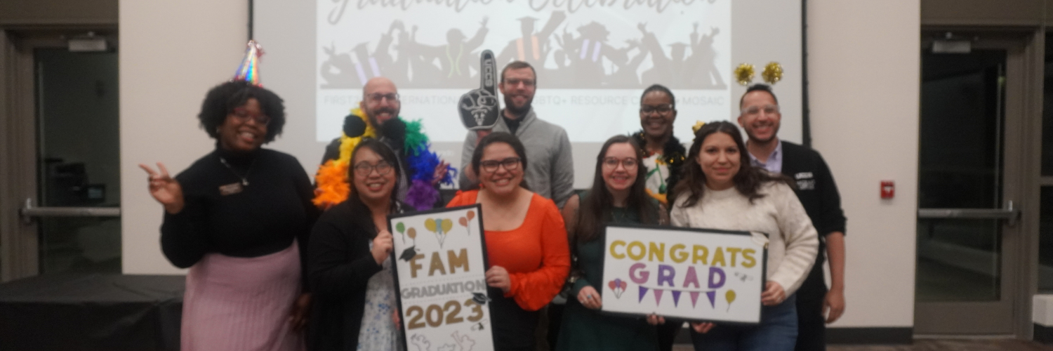 A photo of the staff who worked on FAM graduation holding props and smiling. From left to right, Whitley Hadley, Rame Hanna, Xuan Troung, Jon DeWitt, Ashley San Miguel, Karlye Enkler,  Nicole Simmons-Rochon, Sloan Gonzalez, and Rafael Norwood